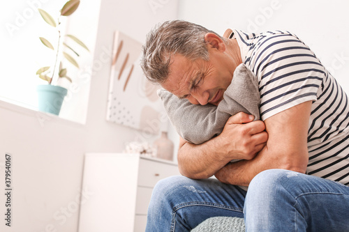 Stressed mature man at home