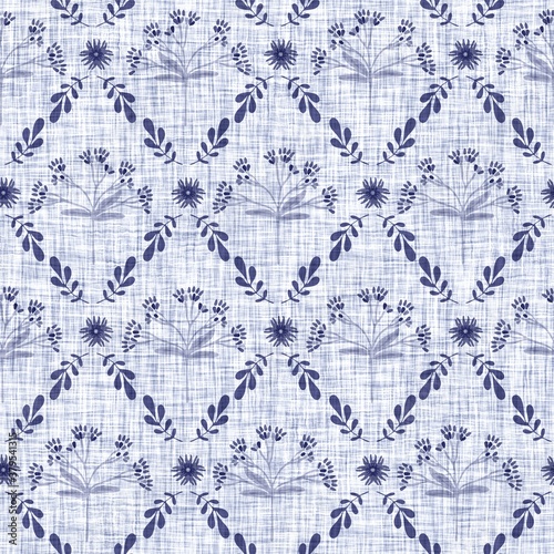 Indigo blue flower block print dyed linen texture background. Seamless woven japanese repeat batik pattern swatch. Floral organic distressed blur block print all over textile.