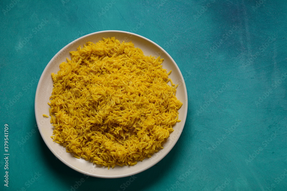 Yellow wild rice cooked with curcuma turmeric spice Yellow wild rice cooked with curcuma turmeric spice