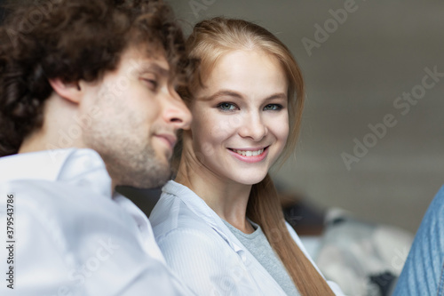 Young happy loving couple close up portrait relax at home. Enjoy together.