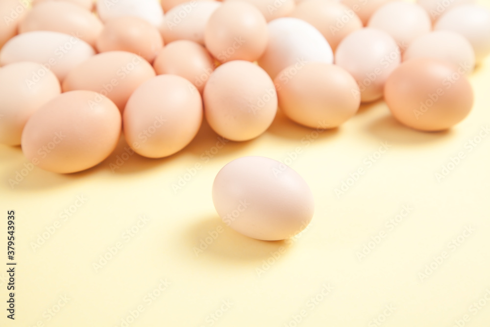 Eggs on yellow background. Food concept Eggs on yellow background. Food concept