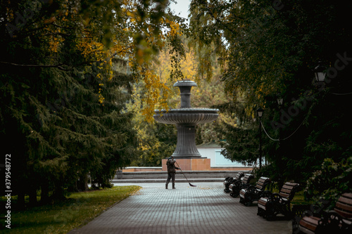 People in the autumn park, cloudy weather, cold