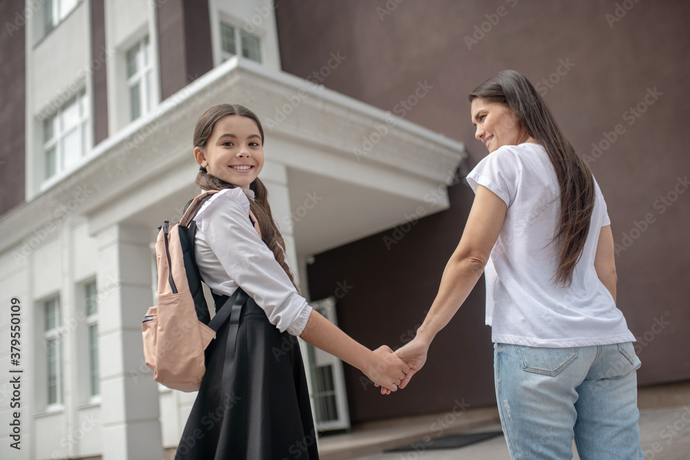 Mom and daughter going to school together and feeling good Mom and daughter going to school together and feeling good
