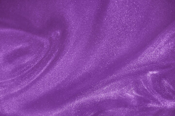 de-focused. Abstract elegant, detailed purple glitter particles flow underwater. Holiday magic shimmering luxury background. Festive sparkles and lights.