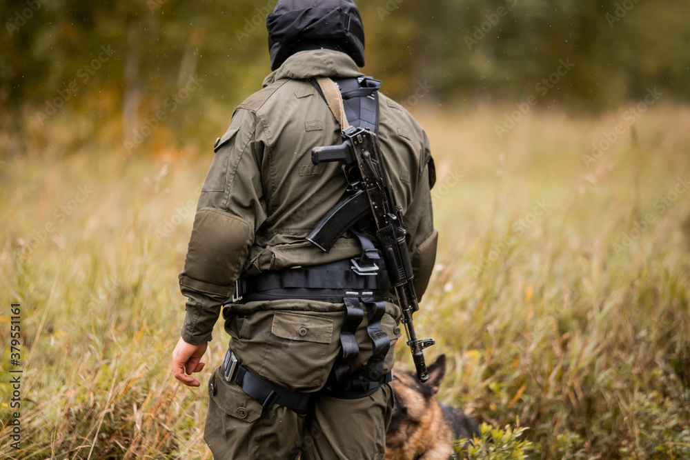 A soldier's Kalashnikov assault rifle, fighting, anti-terror, Special forces team. Russian police (Spetsnaz).