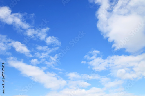 nature background.  white clouds over blue sky soft focus.