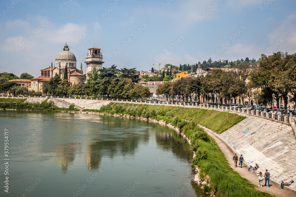View of the Adige embankment and the Church of Saint Stephen in Verona, Veneto, Italy