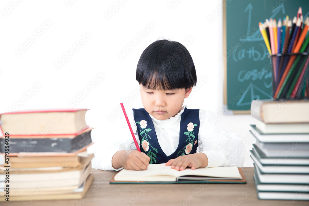 Little chinese girl learning to write Little chinese girl learning to write