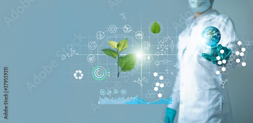 Scientists touching blue earth and researching renewable energy with plant and icon ecology on blue background