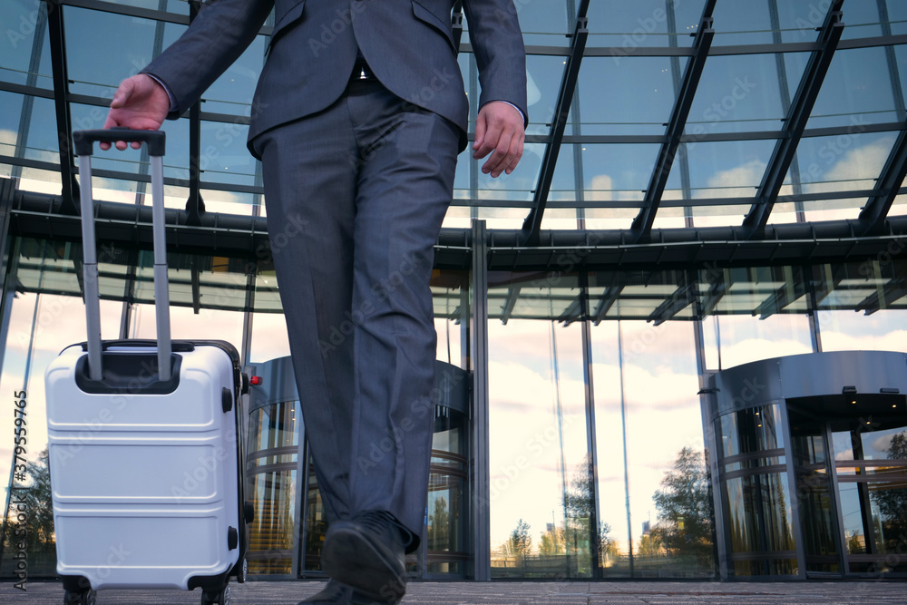 Elegant asian businessman checking email on mobile phone while walking with suitcase inside airport, experienced male employer using cell telephone while waiting for taxi car coming before work travel Elegant asian businessman checking email on mobile phone while walking with suitcase inside airport, experienced male employer using cell telephone while waiting for taxi car coming before work travel