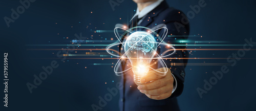 Businessman holding light bulb and brain inside, Idea and imagination, Creative and inspiration, Science innovation with network connection, Solution analysis and development, Innovative technology. photo