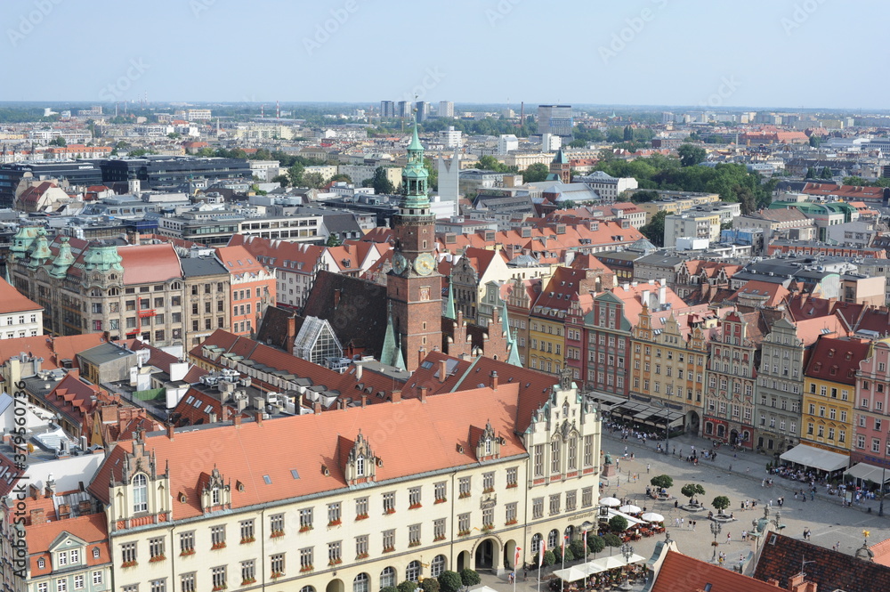 Naklejka premium Aerial view of panorama of old town in the city of Wroclaw or Breslau in southern Poland in summer with red tile roofs