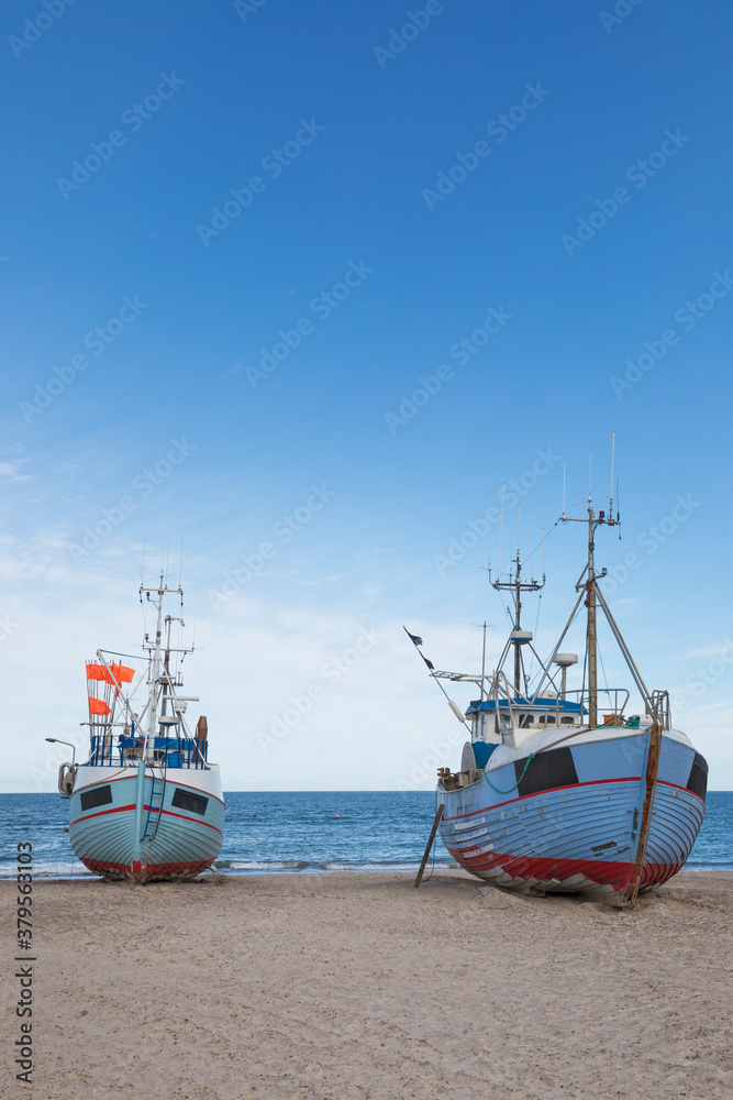 Fishing boats at Thorup Strand beach on the Danish North Sea coast Fishing boats at Thorup Strand beach on the Danish North Sea coast