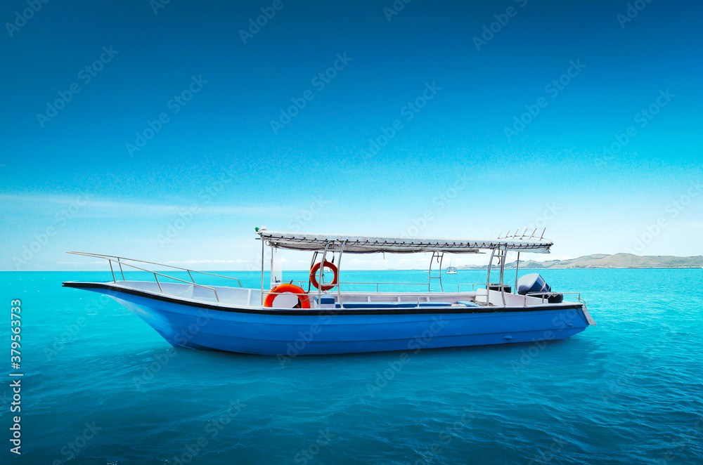 Fototapeta premium Motor boat on sea with blue sky