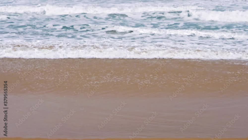 Close up of slow motion barreling wave with wind spray and raw natural Close up of slow motion barreling wave with wind spray and raw natural