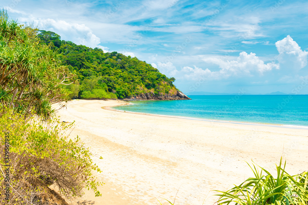 Tropical beach with white sand and green mountain in Koh Lanta island, Thailand