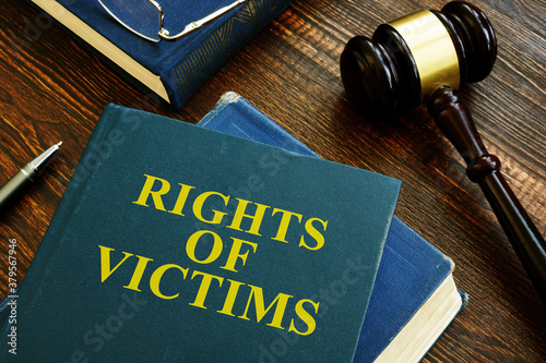 Rights of victims book on the wooden surface. photo