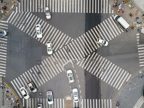 Photography Drone aerial view of cross road with people and traffic cars in downtown