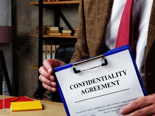 Slika na platnu The chief offers confidentiality agreement for signing.