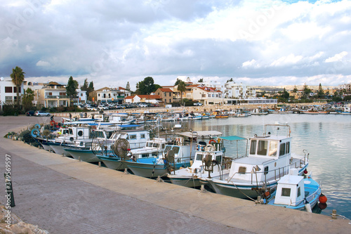 Old fishing boats in the Mediterranean sea harbor of fishing village Zygi on Cyprus island