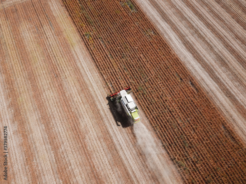Top view of Combine harvesting genetically modified soya bean Top view of Combine harvesting genetically modified soya bean