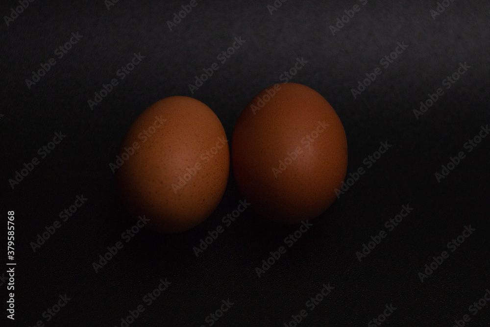 traditional healthy italian food. Tasty and fresh brown chicken eggs, raw and cooked, with their yellow yolk and egg white. Protein breakfast. Natural healthy food and organic farming concept. traditional healthy italian food. Tasty and fresh brown chicken eggs, raw and cooked, with their yellow yolk and egg white. Protein breakfast. Natural healthy food and organic farming concept.