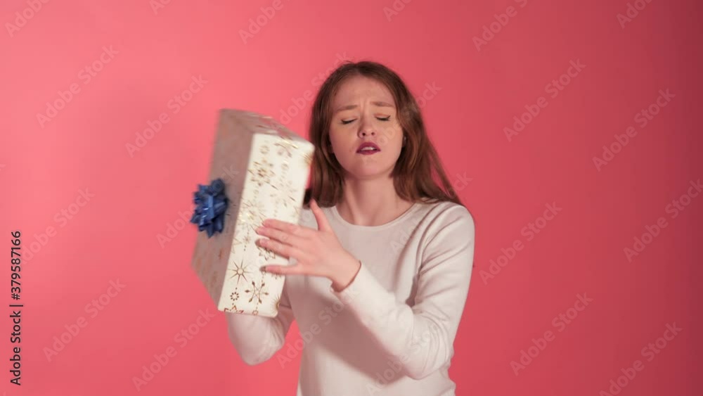 Excited Pretty Young Woman Shakes Gift Box To Guess What Is Inside, Cute Excited Pretty Young Woman Shakes Gift Box To Guess What Is Inside, Cute