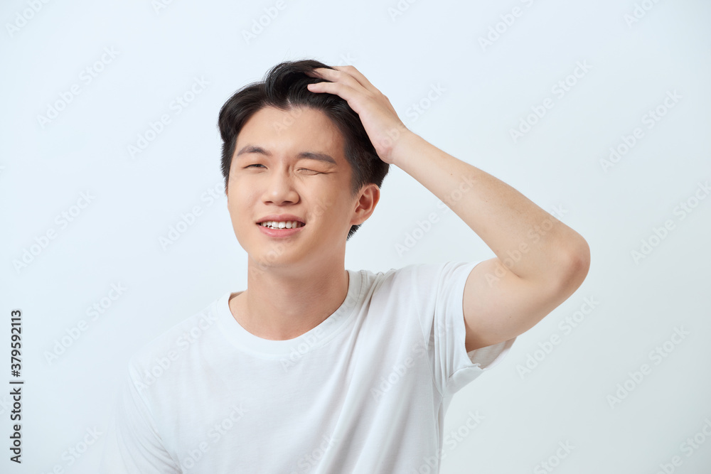Handsome male model with healthy clean skin gently smiling Handsome male model with healthy clean skin gently smiling