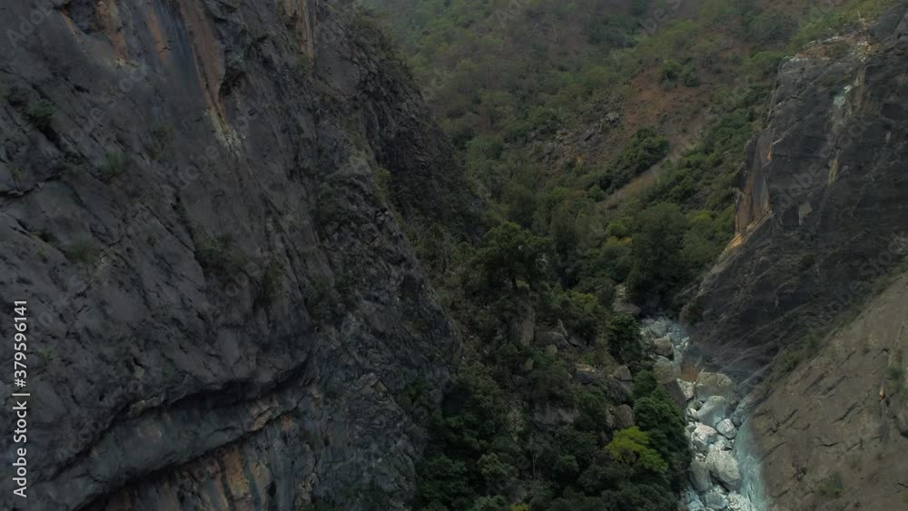 Aerial view of drone flying through the a large gorge on a cold foggy winter day in the Bungonia National Park NSW Australia Aerial view of drone flying through the a large gorge on a cold foggy winter day in the Bungonia National Park NSW Australia