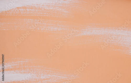 Brush stroke stains paint texture white on peach background