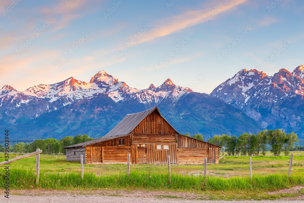 The abandoned barn in the Mormon Row, Wyoming with Grand Tetons view. The abandoned barn in the Mormon Row, Wyoming with Grand Tetons view.