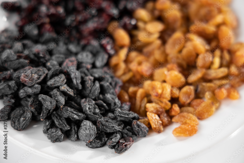 Fototapeta premium healthy dried fruits on white background