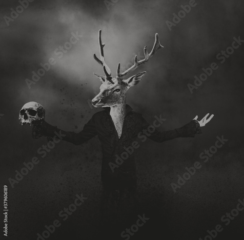 Animals in clothes. human figure with deer head keeps a skull in his hand. horror and halloween concept