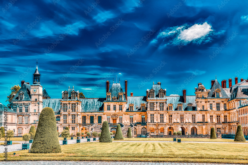 FONTAINEBLEAU, FRANCE - JULY 09, 2016 : Suburban Residence of the France Kings - facade  beautiful Chateau Fontainebleau and surrounding his park.