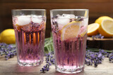 Fresh delicious lemonade with lavender on wooden table