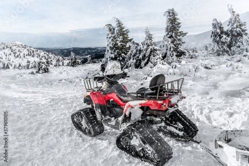 Ski resort service, mobile rescue motorcycle on tracked wheels