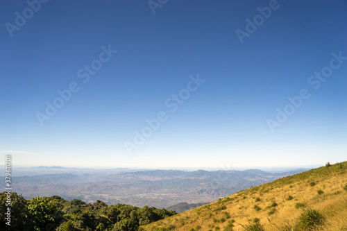 Mountain landscape with blue sky.