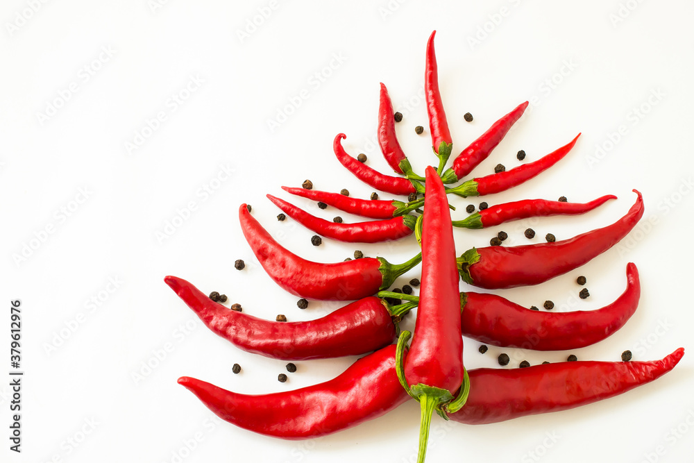 red bitter chili pepper in the form of a christmas tree on a white clean background for text red bitter chili pepper in the form of a christmas tree on a white clean background for text