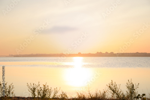 Picturesque view of beautiful sunrise on riverside. Morning sky