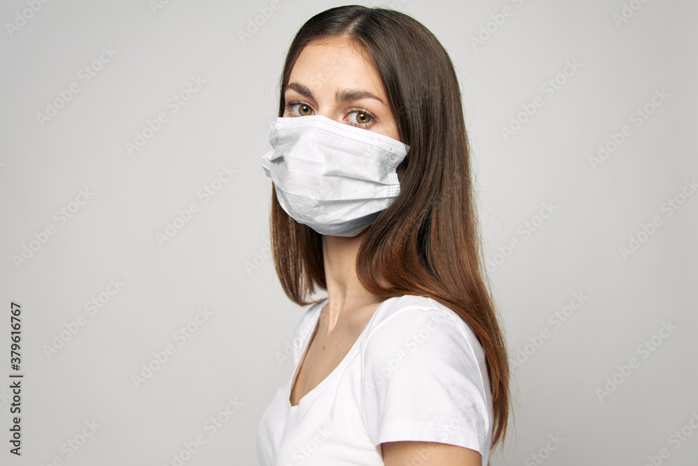 Woman wearing medical mask looks ahead Cropped view Woman wearing medical mask looks ahead Cropped view