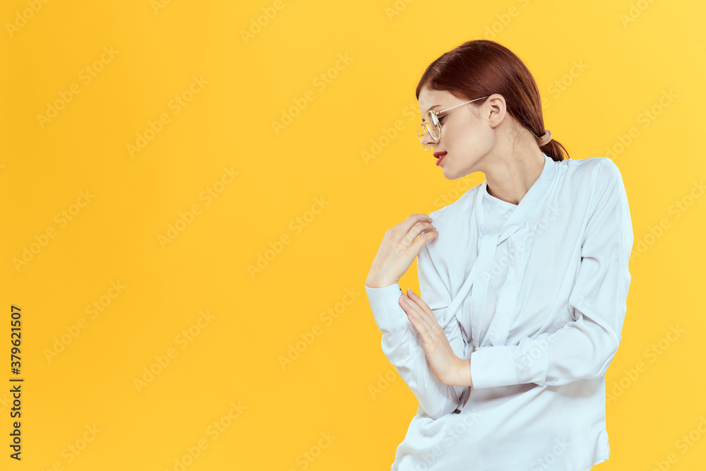 woman in white shirt wearing glasses red lips elegant style yellow isolated background woman in white shirt wearing glasses red lips elegant style yellow isolated background