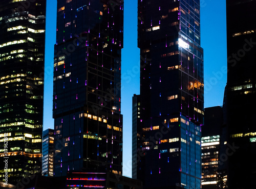 Towers of modern sky with lights, evening, journey, city.