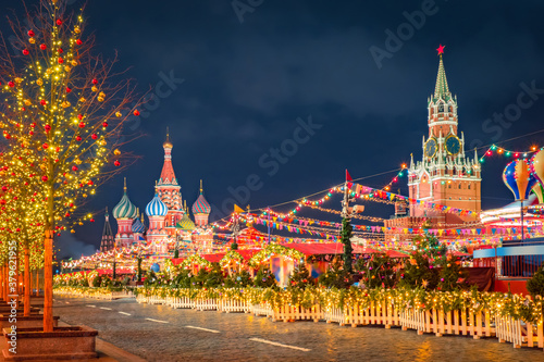 Red Square in Moscow. Christmas decorations in Russia. New Year's decorations in front of Kremlin. Landscape of Christmas Moscow. Panorama of Red Square in winter night. Basil's Sabor in Russia.