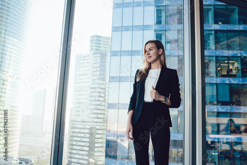 Fotografija Cheerful blonde female manager in formal outfit enjoying job and successful care