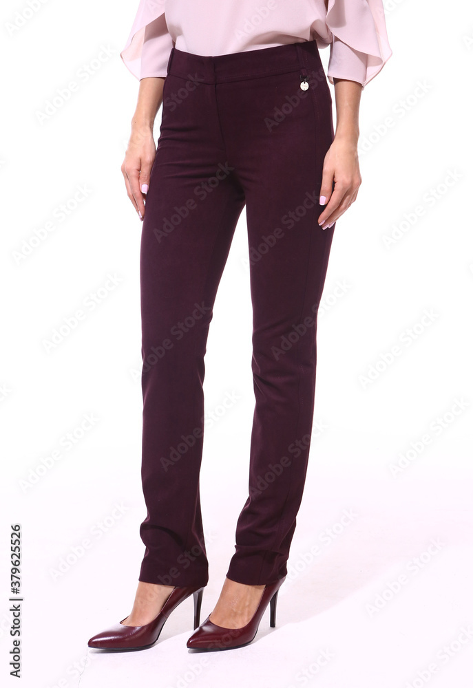 official formal short trousers on model legs, high heels shoes closeup photo isolated on white official formal short trousers on model legs, high heels shoes closeup photo isolated on white