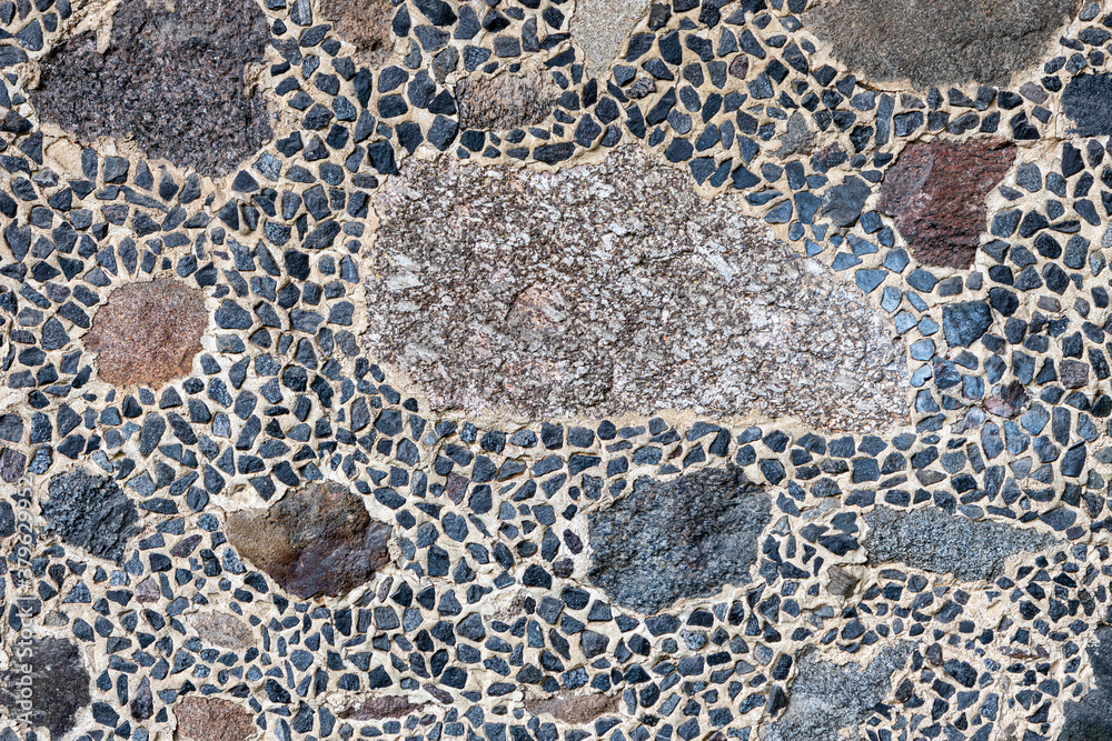 Old stone wall background texture close up. Stone background. Old stone wall background texture close up. Stone background.