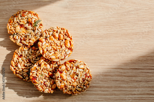  Kozinak cookies made from seeds and nuts on a wooden background. Flat lay, top view, copy space