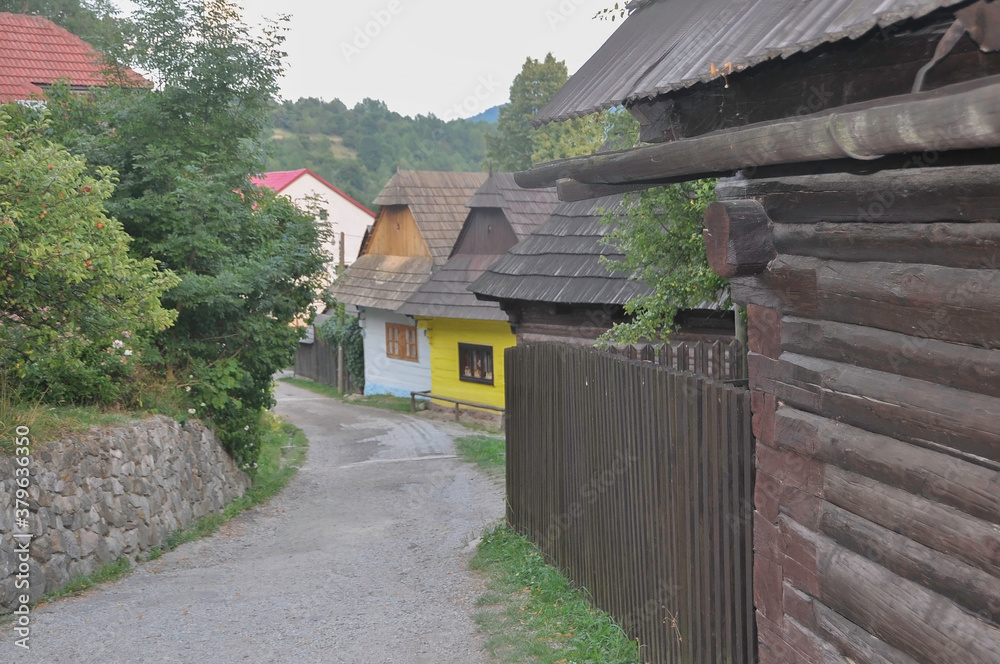 VLKOLINEC, SLOVAKIA, EUROPE, SUMMER 2015. Beautiful street in the center of Vlkolinec village, a Unesco heritage site. The houses are made of wood and painted in neutral colors.