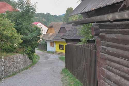VLKOLINEC, SLOVAKIA, EUROPE, SUMMER 2015. Beautiful street in the center of Vlkolinec village, a Unesco heritage site. The houses are made of wood and painted in neutral colors.