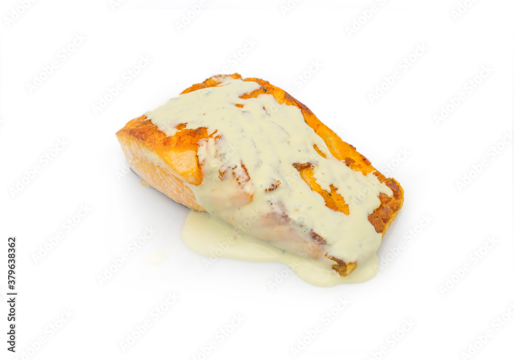 Steamed salmon steak with white sauce isolated on white background. Fish fillet isolation for restaurant menu.